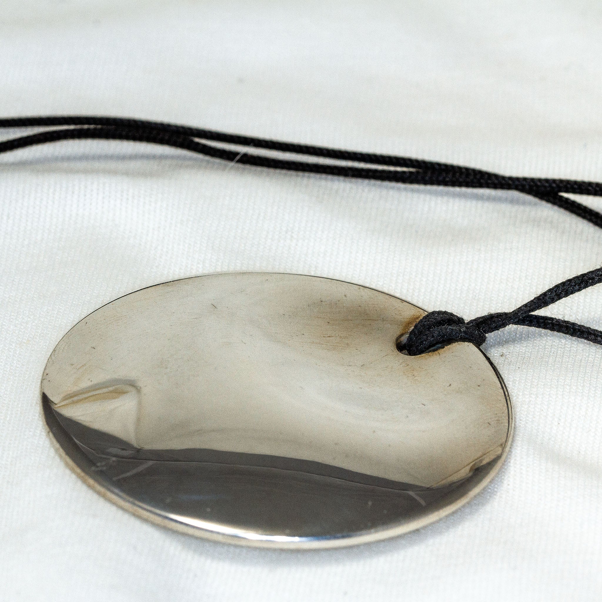 Authentic Tiffany & Co. Elsa Peretti 2" Silver Round Disc Pendant on Black Cord - Pre-Owned Secondary image